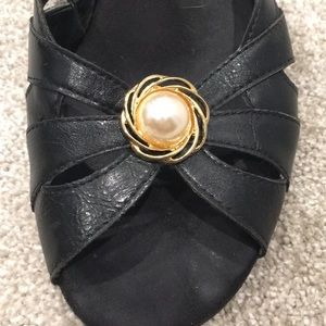 Gold and pearl clip on earrings.